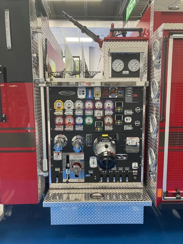 Pump panel close-up showing gauges, valves, and control levers