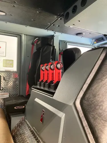 Cab interior side view showing rear seats and center aisle