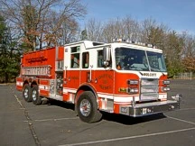 Wide front-right view of the tanker parked in the lot with full cab and body visible.