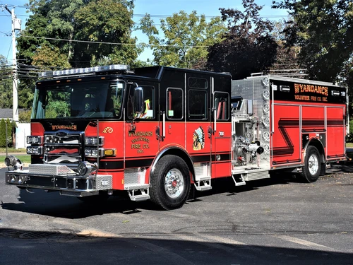 Pumper front-left exterior view showing black cab top and side body