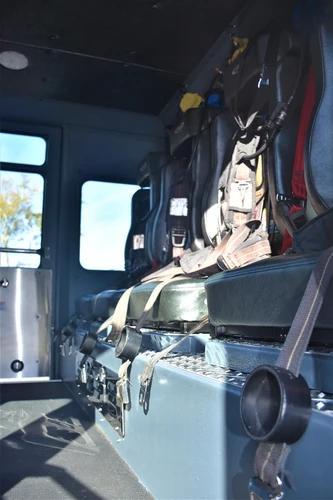 Cab interior side view showing rear seat and aisle space