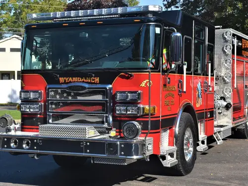 Head-on front view showing grille, bumper intakes, and warning lights