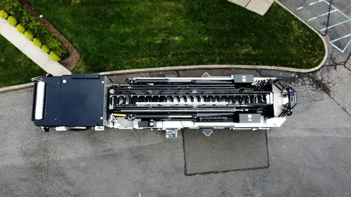 Aerial top-down rear view showing rear body deck and ladder base area