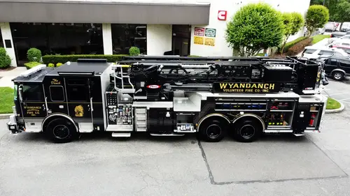 Aerial top-down rear-quarter view showing rear deck and outriggers