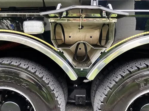 Open side compartment showing narrow vertical storage channel