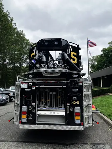 Rear view showing ladder access, intake outlets, and open center compartment