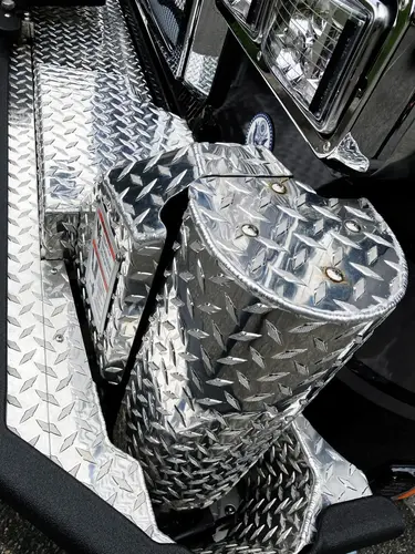 Open side body close-up showing upper grab rail and ladder base structure