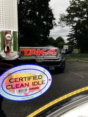 Cab-side trim close-up with reflective stripe and body contour