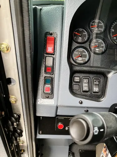 Side window view showing front seat and cab control area
