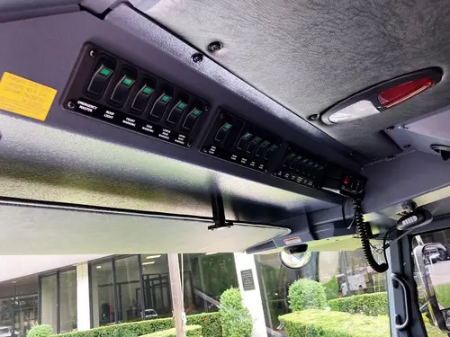 Cab interior close-up showing overhead switch panel and radio area