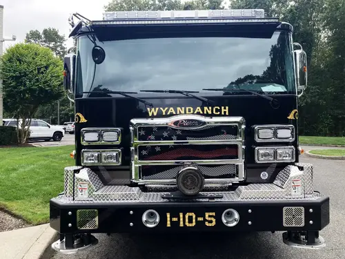 Head-on front view showing grille, bumper intakes, and warning lights