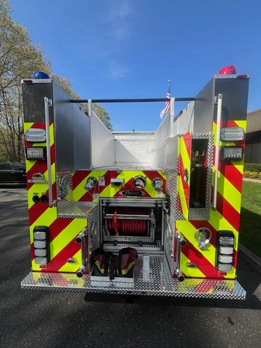 Open side compartment with pull-out tray showing extrication tools and struts